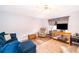 Comfortable living room with wood floors, neutral paint, and lots of seating at 147 13Th Ave, Longwood, FL 32750