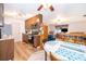 Open kitchen and living area with wood floors, bright natural light at 147 13Th Ave, Longwood, FL 32750