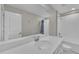 Bright bathroom featuring a white vanity, mirror, shower, and bath at 1616 Oak Blossom Dr, Davenport, FL 33837