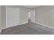 Spacious bedroom with neutral tones, a large closet, and soft carpeting at 1616 Oak Blossom Dr, Davenport, FL 33837