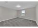 Neutral bedroom featuring a window and gray carpet at 1616 Oak Blossom Dr, Davenport, FL 33837