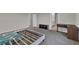 Large bedroom with gray carpet and an empty bed frame with attached desk at 1616 Oak Blossom Dr, Davenport, FL 33837