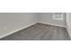 Bedroom featuring neutral walls, soft gray carpet, and a window bringing in natural light at 1616 Oak Blossom Dr, Davenport, FL 33837
