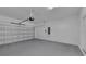 Spacious garage with modern door system, ample space, and clean, painted walls, offering secure parking at 1616 Oak Blossom Dr, Davenport, FL 33837