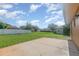 Expansive backyard features a well-maintained lawn and concrete patio at 1644 Piccadilly Dr, Daytona Beach, FL 32117