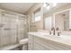 Bathroom featuring a glass shower, single sink, and white cabinets at 1644 Piccadilly Dr, Daytona Beach, FL 32117