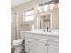 Bathroom features white cabinets and countertops and a glass-doored shower stall at 1644 Piccadilly Dr, Daytona Beach, FL 32117