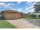 Charming single-story brick home featuring a spacious two-car garage at 1644 Piccadilly Dr, Daytona Beach, FL 32117