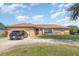Lovely single-story home with a brick facade, garage, and a spacious front yard at 1644 Piccadilly Dr, Daytona Beach, FL 32117