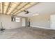 Spacious two-car garage with concrete floor, water heater, and electrical panel at 1644 Piccadilly Dr, Daytona Beach, FL 32117