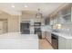 Modern kitchen with gray cabinets, subway tile backsplash, and updated appliances at 1644 Piccadilly Dr, Daytona Beach, FL 32117