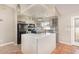 Kitchen featuring an island with white countertop and grey cabinets and stainless appliances at 1644 Piccadilly Dr, Daytona Beach, FL 32117