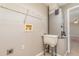 Functional laundry room with utility sink and storage shelf at 1644 Piccadilly Dr, Daytona Beach, FL 32117
