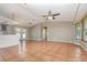 Spacious living room with tile flooring, a ceiling fan, and natural light at 1644 Piccadilly Dr, Daytona Beach, FL 32117