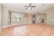 Bright living room featuring tile floors, a bay window, and a ceiling fan at 1644 Piccadilly Dr, Daytona Beach, FL 32117