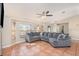 Bright living room featuring a large sectional sofa, tile floors, and natural light at 1644 Piccadilly Dr, Daytona Beach, FL 32117
