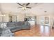 Open-concept living room featuring tile floors, a sofa and a view of the kitchen at 1644 Piccadilly Dr, Daytona Beach, FL 32117