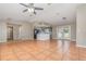 Open-concept living area adjacent to a stylish kitchen with access to the backyard at 1644 Piccadilly Dr, Daytona Beach, FL 32117