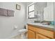 Clean bathroom featuring a vanity, toilet, and framed print at 16613 Caribbean Breeze Way # 34714, Clermont, FL 34714