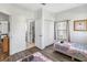 Spacious bedroom featuring two twin beds, a closet, and a window with wood blinds, perfect for guests at 16613 Caribbean Breeze Way # 34714, Clermont, FL 34714