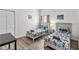 Well-lit bedroom featuring twin beds with playful Batman-themed bedding and a neutral color scheme at 16613 Caribbean Breeze Way # 34714, Clermont, FL 34714