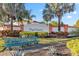 Welcoming High Grove entrance sign with decorative landscaping and bench seating, creating a lovely community atmosphere at 16613 Caribbean Breeze Way # 34714, Clermont, FL 34714