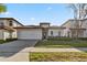 Charming single-story home with a well-maintained lawn and a red tile roof at 16613 Caribbean Breeze Way # 34714, Clermont, FL 34714