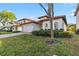Charming single-story home with a well-maintained lawn and a red tile roof at 16613 Caribbean Breeze Way # 34714, Clermont, FL 34714