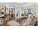 Bright living room with comfortable seating and view to an open floor plan at 16613 Caribbean Breeze Way # 34714, Clermont, FL 34714