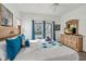 Bright bedroom with a king-size bed and ensuite bathroom at 16613 Caribbean Breeze Way # 34714, Clermont, FL 34714