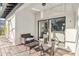 Relaxing covered patio with seating area, great for outdoor dining and entertainment, directly accessible from the living room at 16613 Caribbean Breeze Way # 34714, Clermont, FL 34714