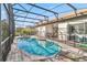 Sparkling private screened pool, with relaxing lounge chairs, offers the perfect retreat for soaking up the sun at 16613 Caribbean Breeze Way # 34714, Clermont, FL 34714