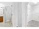 Hallway view with a bathroom and a walk-in closet at 16817 Gold Star Ct, Clermont, FL 34714
