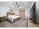 Well-lit bedroom features tray ceiling, ceiling fan, and soft neutral decor at 171 Bogey Dr, Davenport, FL 33896