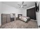 Bedroom with gray furniture and decorative pillows, a vanity, and soft gray carpet at 171 Bogey Dr, Davenport, FL 33896