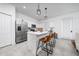 Bright kitchen featuring a center island with barstool seating and modern appliances at 171 Bogey Dr, Davenport, FL 33896