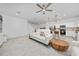 Bright and airy living room with modern decor open to the kitchen at 171 Bogey Dr, Davenport, FL 33896