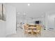 Open floor plan displaying the dining area, kitchen, and living room at 171 Bogey Dr, Davenport, FL 33896