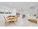 Open-concept space that combines the dining, kitchen, and living areas for modern living at 171 Bogey Dr, Davenport, FL 33896