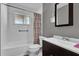 Bathroom with a tub, shower, toilet, large vanity, and a framed mirror is well maintained at 1868 Wayside Dr, Orlando, FL 32818