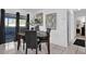 Contemporary dining area featuring a stylish table set and sliding glass door for outdoor views, perfect for gatherings at 1868 Wayside Dr, Orlando, FL 32818