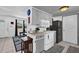 Efficient kitchen featuring ample countertop space, clean appliances, and convenient access to the living area for easy entertaining at 1868 Wayside Dr, Orlando, FL 32818