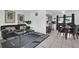 Cozy living area flowing into the dining space, featuring neutral decor and comfortable seating, with easy kitchen access at 1868 Wayside Dr, Orlando, FL 32818