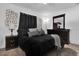 Comfortable main bedroom featuring dark furniture, neutral walls and decor, with a cozy feel at 1868 Wayside Dr, Orlando, FL 32818