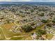 Aerial view of a residential neighborhood with tree-lined streets and well-maintained homes at 1949 Manatee Dr, Kissimmee, FL 34759