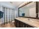 Beautiful bathroom with dual sink vanity and shower with curtain at 1949 Manatee Dr, Kissimmee, FL 34759