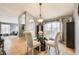Cozy dining area with a round glass table, comfortable chairs, and natural lighting at 1949 Manatee Dr, Kissimmee, FL 34759
