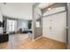Open foyer with large front door, high ceilings, tile flooring, and modern gray walls at 1949 Manatee Dr, Kissimmee, FL 34759