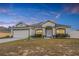 Charming single-story home with neutral stucco and landscaped front yard at 1949 Manatee Dr, Kissimmee, FL 34759