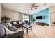 Comfortable living room featuring stylish furniture, tile floors, and ample natural light at 1949 Manatee Dr, Kissimmee, FL 34759